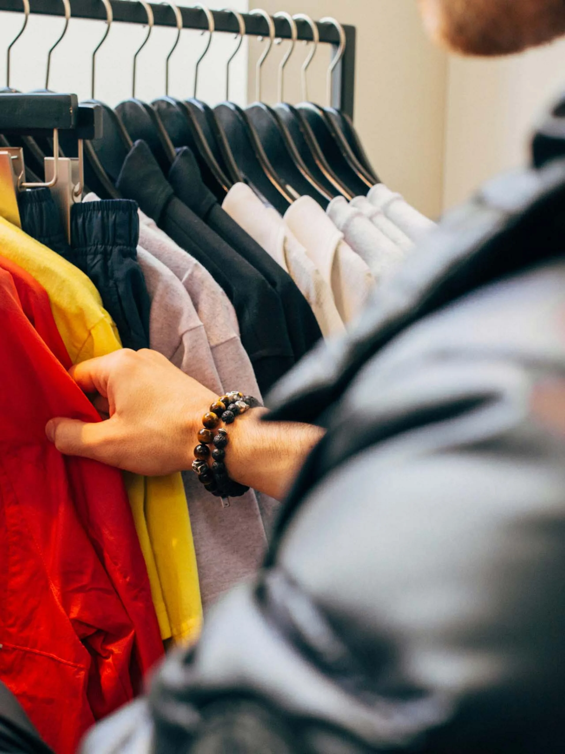 Pfalzblick: your nature hotel in Rhineland-Palatinate Man browsing colorful clothes on a clothing rack